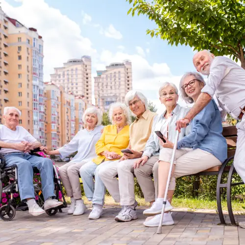 Rest home residents enjoying companionship in a welcoming community.
